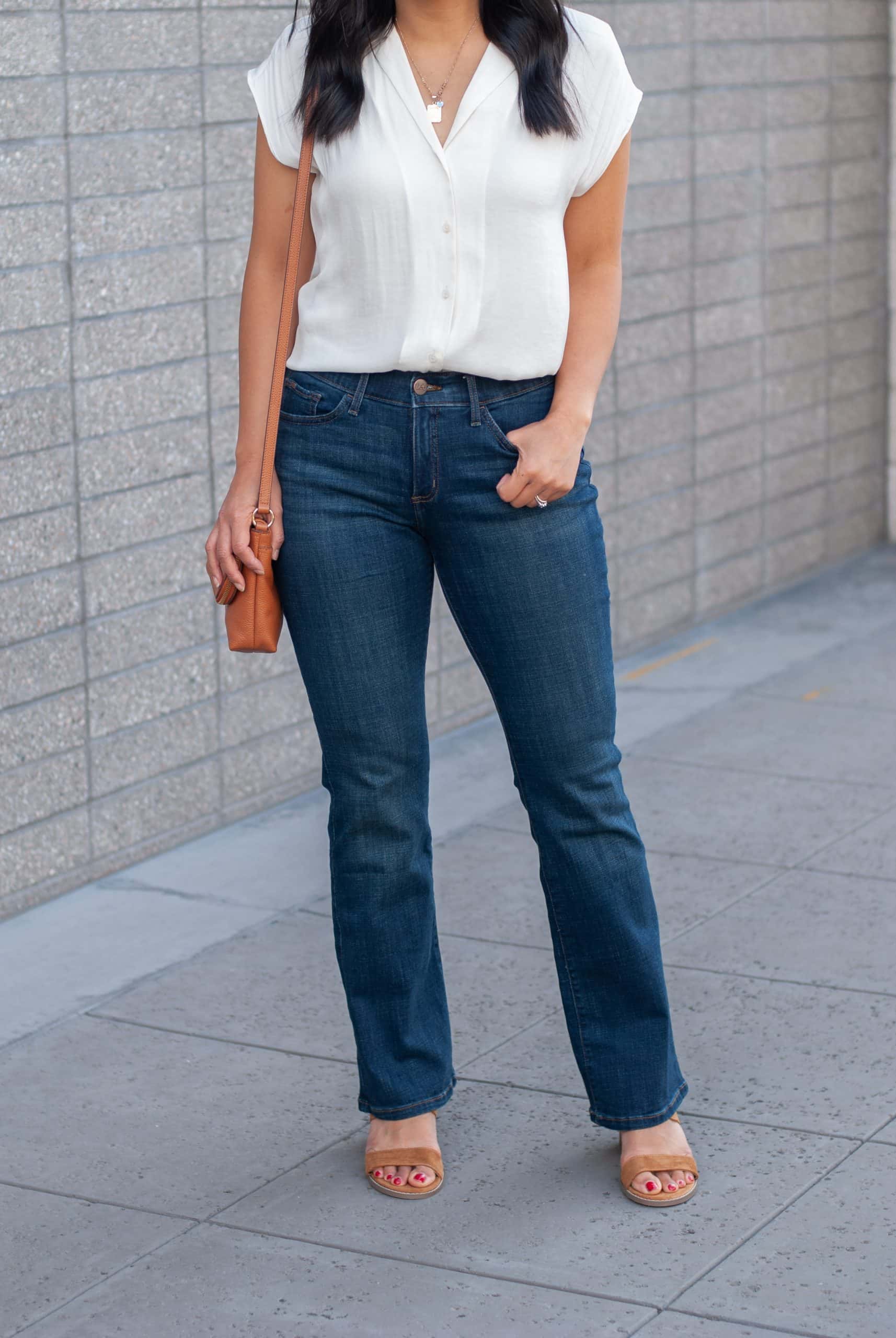 white top + dark wash bootcut jeans + gold hoop earrings + gold initial necklace + cognac heeled sandals + cognac bag white top + dark wash bootcut jeans + gold hoop earrings + gold initial necklace + cognac sandals + cognac bag