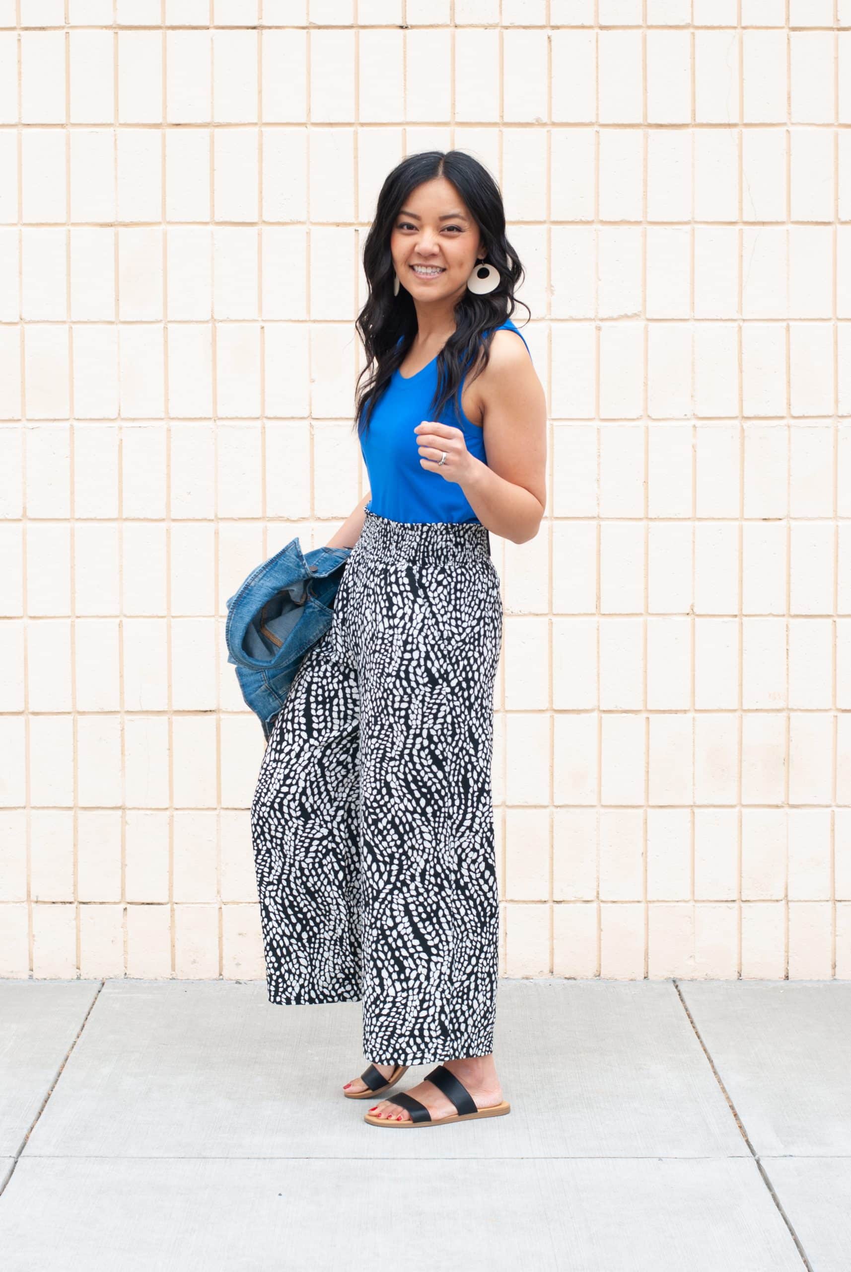 bright blue tank top + black and white printed cropped wide leg pants + black sandals + denim jacket + gold earrings bright blue tank top + black and white printed wide leg silky soft travel pants + black sandals + denim jacket + gold leather earrings