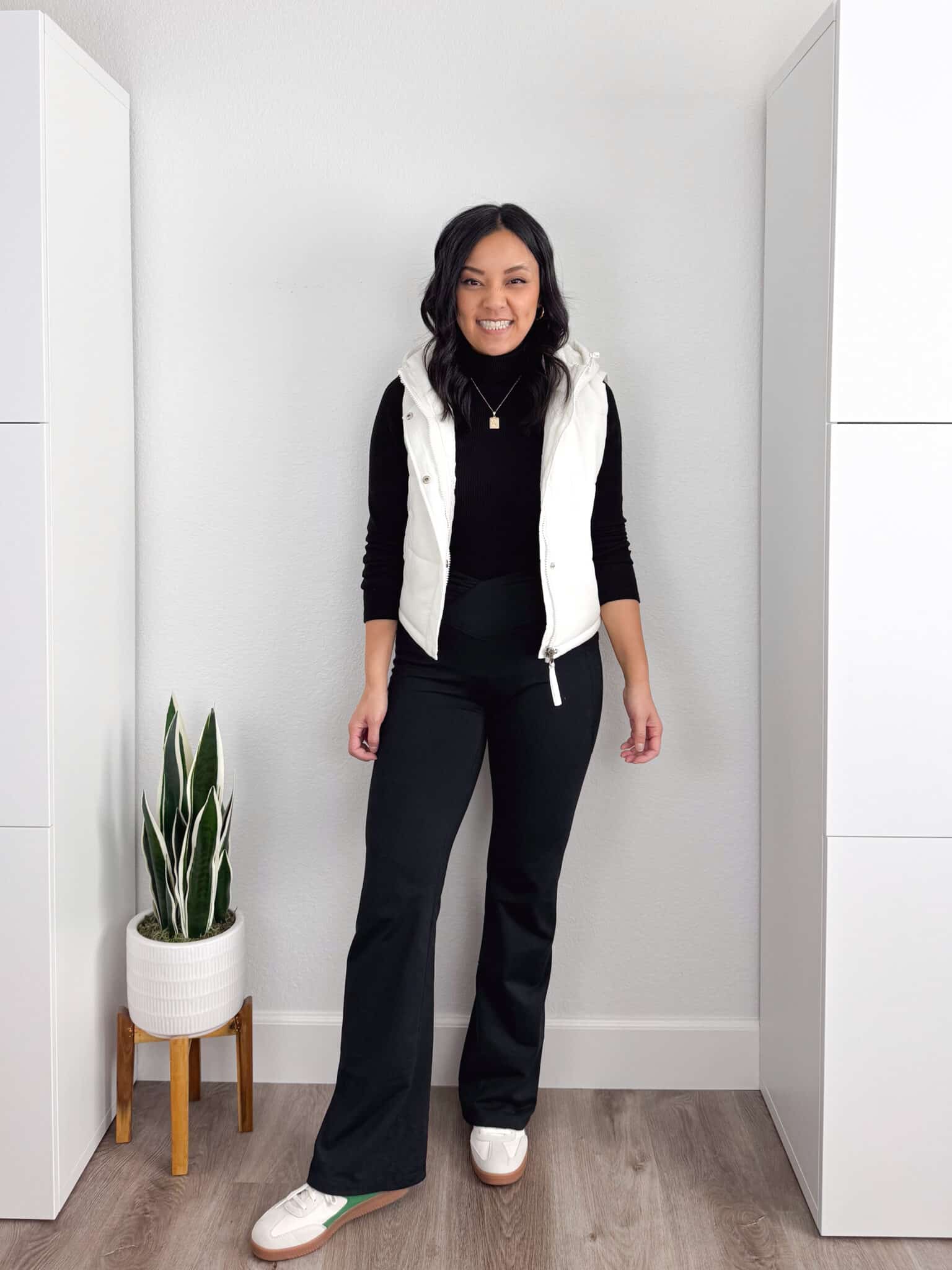 black tee + white vest + black wide leg fleece lined pants + white sneakers + gold jewelry
