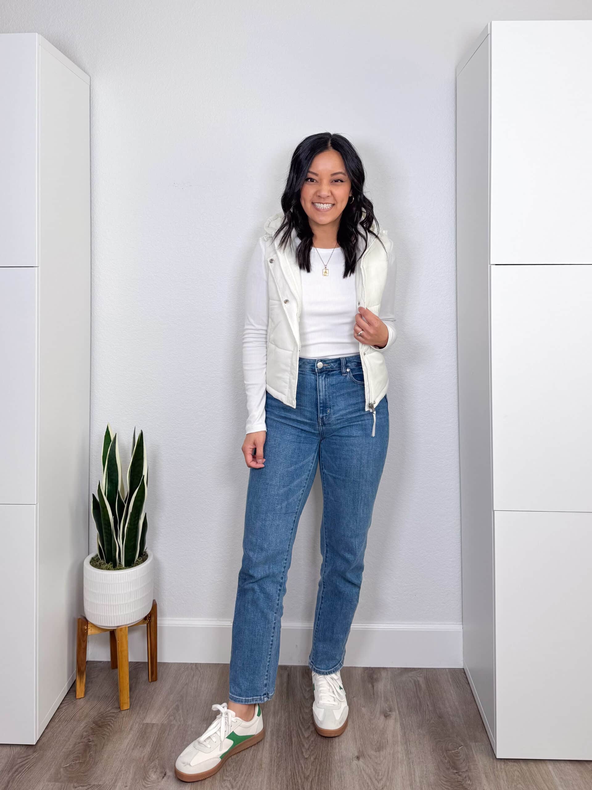 putting me together + straight leg medium wash jeans + white long sleeve tee + white puffer vest + white sneakers + gold jewelry putting me together + straight leg medium wash jeans + white long sleeve tee + white puffer vest + white sneakers