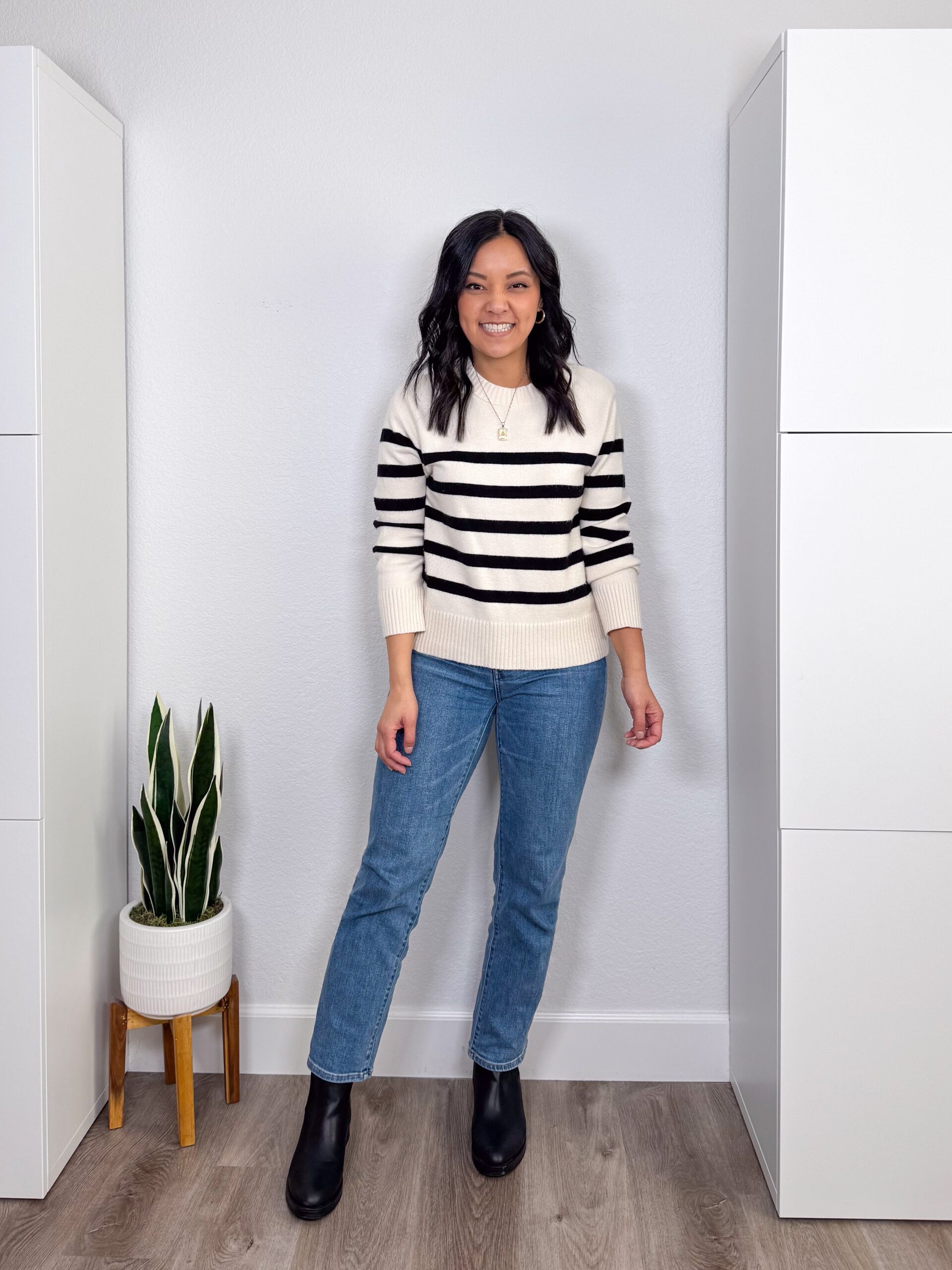 putting me together + straight leg medium wash jeans + white and black striped sweater + black boots + gold jewelry putting me together + printed sweater + straight leg medium wash jeans + white and black striped sweater + black boots