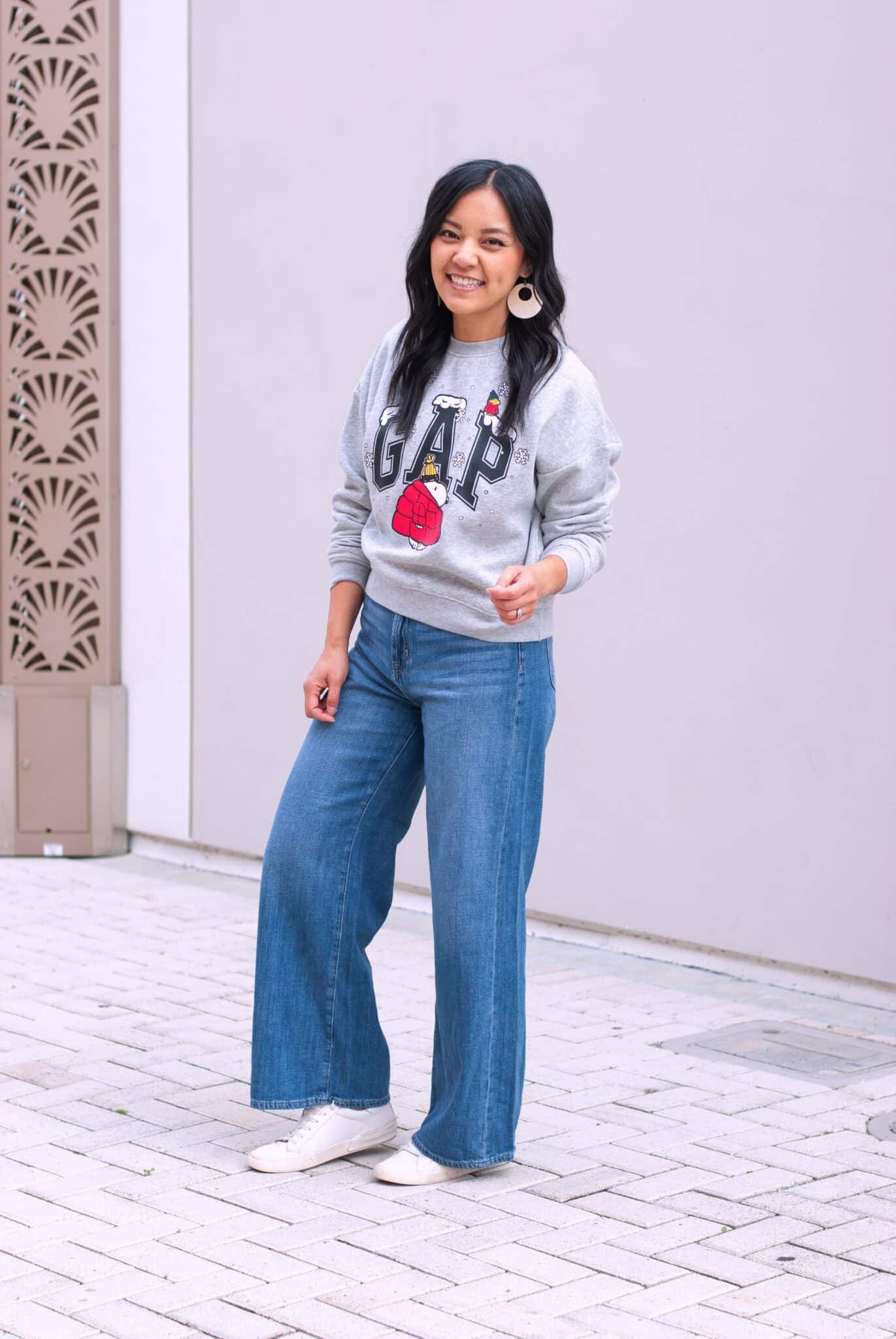 holiday outfits for casual gatherings + Easygoing Holiday Outfits for Casual Gatherings (That Still Look Cute) + 50-70% Off Everything with Gap Factory!!! + putting me together + holiday graphic print snoopy sweatshirt + jeans + white sneakers