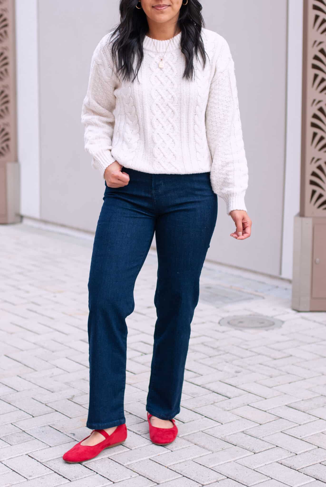 Easy Casual Holiday Outfit White Cable Knit Sweater Dark Wash Straight Leg Jeans Red Mary Jane Shoes Close Up