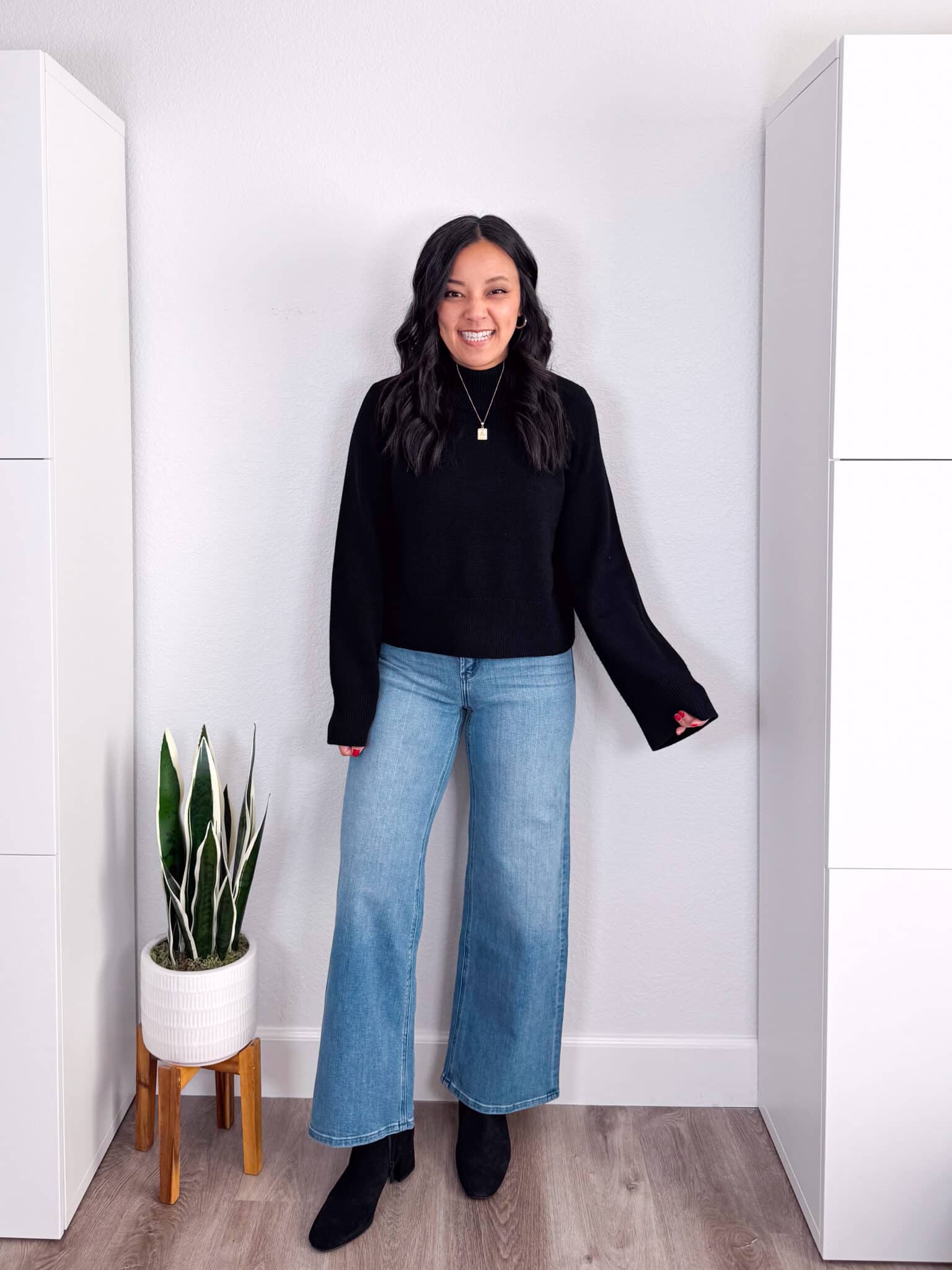 11 Wardrobe Essentials for Women Over 40 The Key Pieces That Make Looking Polished Easy + wardrobe essentials for women over 40 + putting me together + cozy black sweater + black water resistant suede boots + structured and stretchy wide leg jeans
