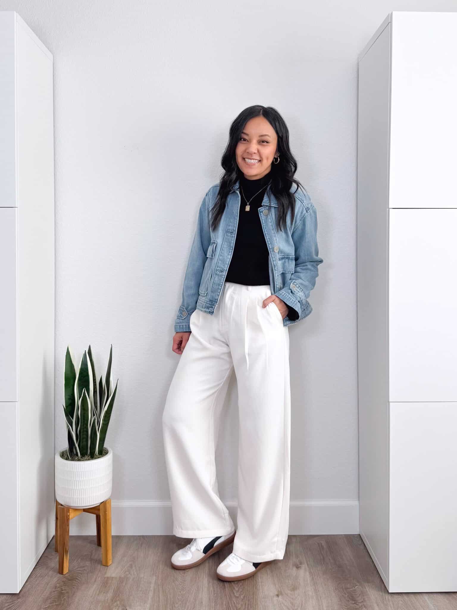 black sweater outfit ideas + putting me together + 10 Black Sweater Outfit Ideas You Can Easily Copy for Winter + versatile black sweater + casual white trousers + white and black lifestyle sneakers + updated denim jacket
