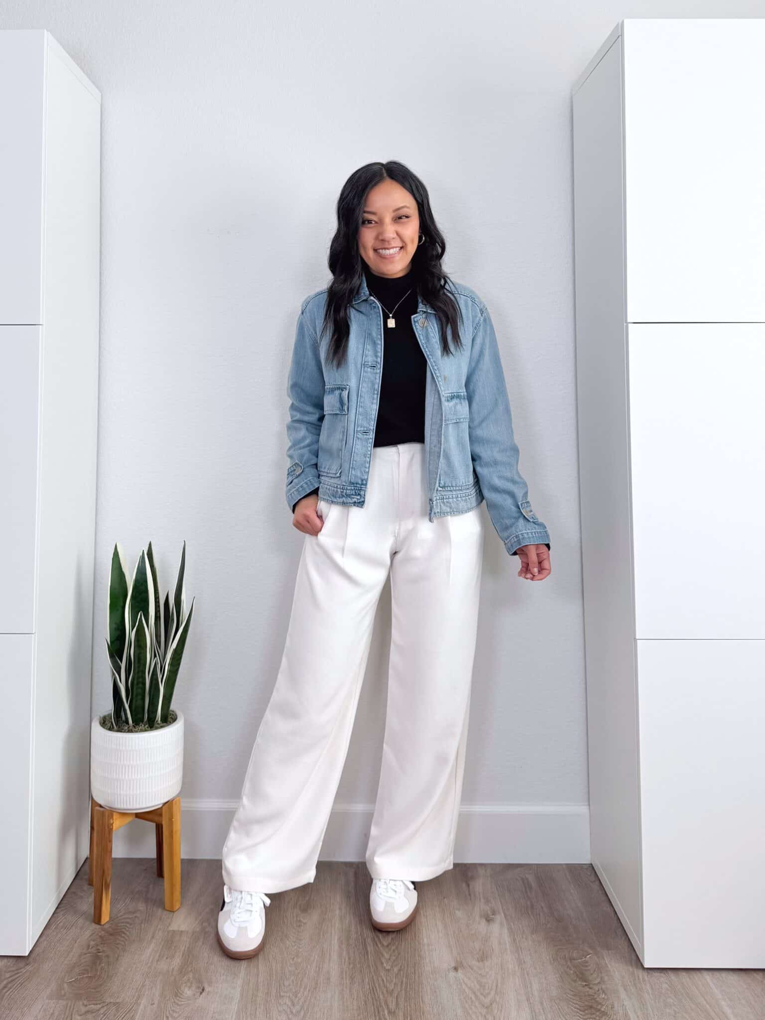 black sweater outfit ideas + putting me together + 10 Black Sweater Outfit Ideas You Can Easily Copy for Winter + versatile black sweater + casual white trousers + white and black lifestyle sneakers + updated denim jacket