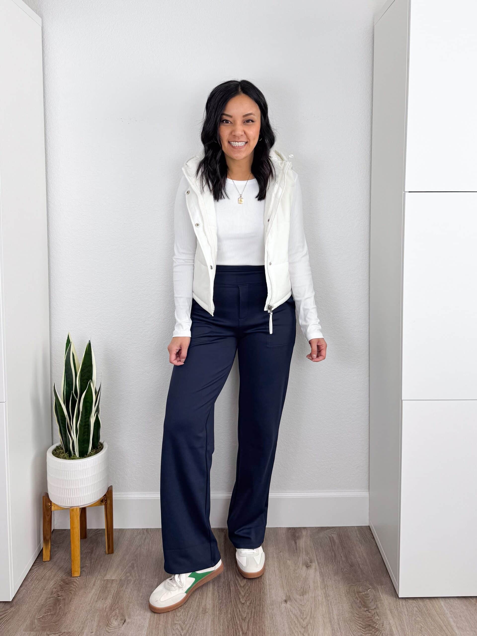 7 Tips & Winter Clothes That Actually Keep You Warm + putting me together + warm winter clothes+ white long sleeve t shirt + fleece lined navy athletic pants + white puffer vest + budget friendly affordable white sneakers