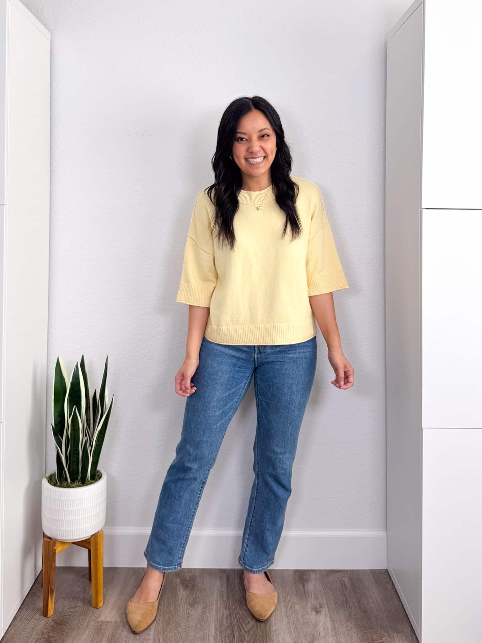 spring try-on haul + putting me together + Spring Try-On Haul: Fun Pieces That Are Stylish, Fresh, and Easy to Wear from Amazon, Old Navy, Ann Taylor, Spanx, and More + versatile black t-shirt + soft short sleeve yellow spring sweater + comfortable medium wash straight leg jeans + tan flats + gold dakota necklace