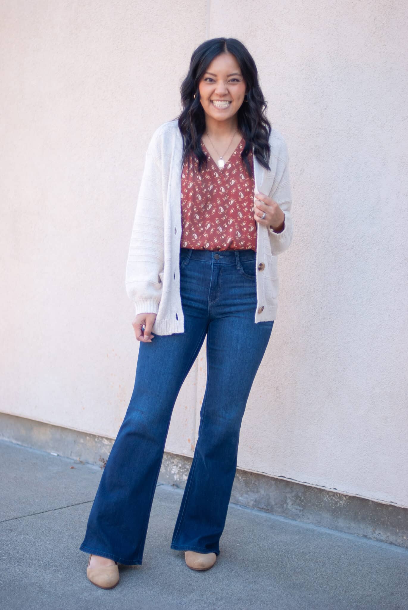 how to dress for spring when it's still cold + putting me together + dress for spring when it's cold + coral and white flowered top + lightweight oatmeal cardigan + comfortable flare jeans + tan flats