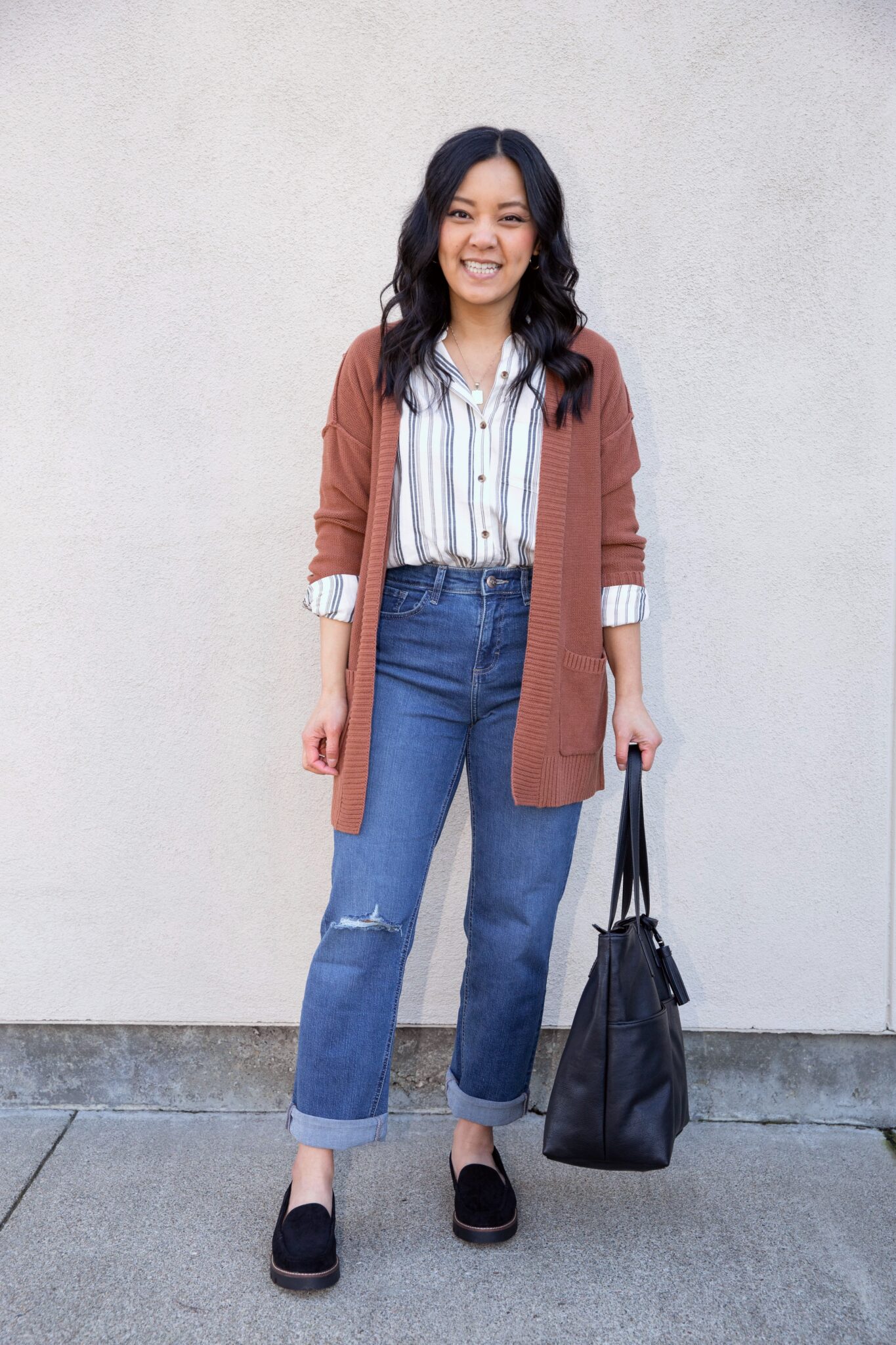 how to dress for spring when it's still cold + putting me together + dress for spring when it's cold + white and navy striped button up shirt + lightweight rust cardigan + comfortable straight leg jeans + black loafers