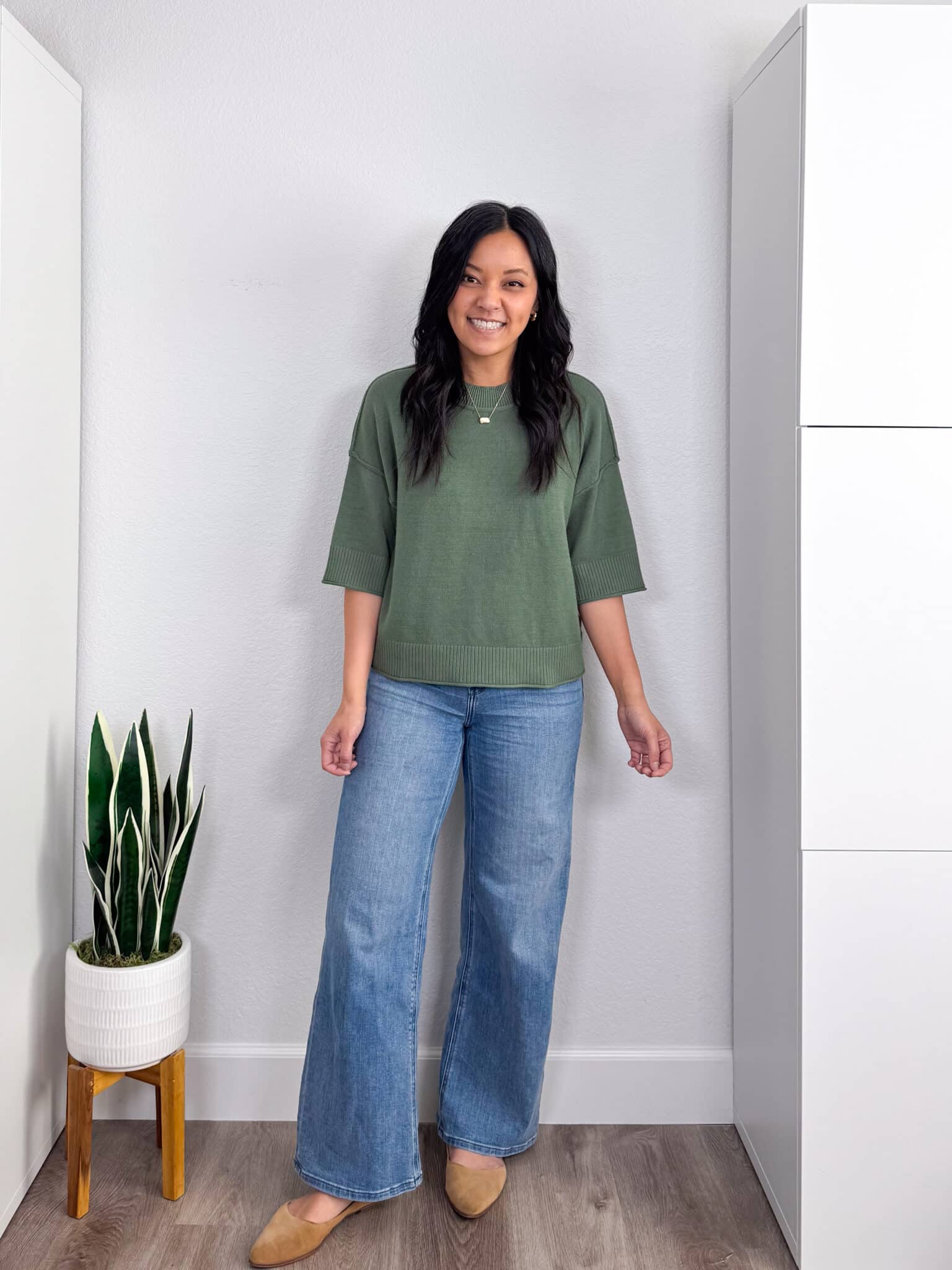 spring try-on haul + putting me together + Spring Try-On Haul: Fun Pieces That Are Stylish, Fresh, and Easy to Wear from Amazon, Old Navy, Ann Taylor, Spanx, and More + versatile black t-shirt + soft short sleeve green spring sweater + comfortable medium wash wide leg jeans + tan flats