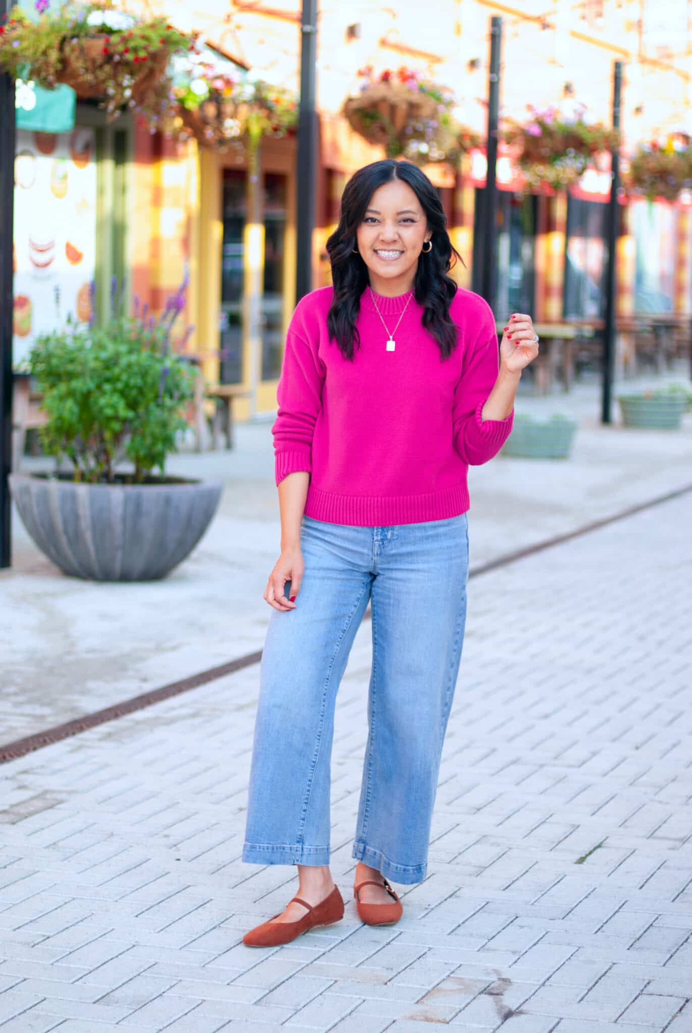 how to dress for spring when it's still cold + putting me together + dress for spring when it's cold + bright pink sweater + comfortable wide leg cropped jeans + versatile tan mary jane flats