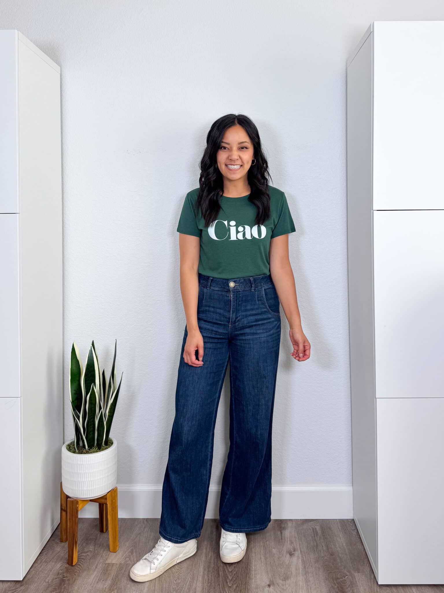 My BEST Pants Recommendations for Spring & Summer + best pants for spring & summer + My BEST Pants for Spring & Summer That You'll Want to Live In + putting me together + easy to wear olive green graphic t-shirt + dark wash comfortable wide leg jeans + white sneakers + gold hoop earrings