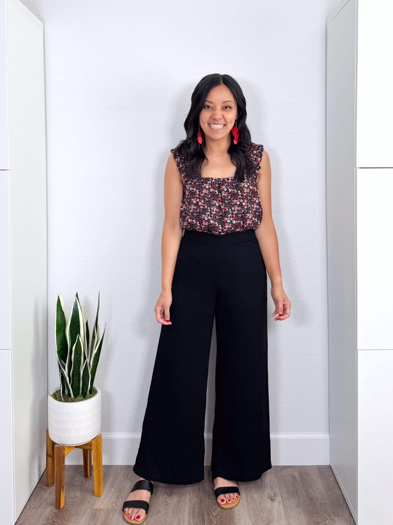 My BEST Pants Recommendations for Spring & Summer + best pants for spring & summer + My BEST Pants for Spring & Summer That You'll Want to Live In + putting me together + flowered top + soft and lightweight black summer pants + black sandals + red earrings