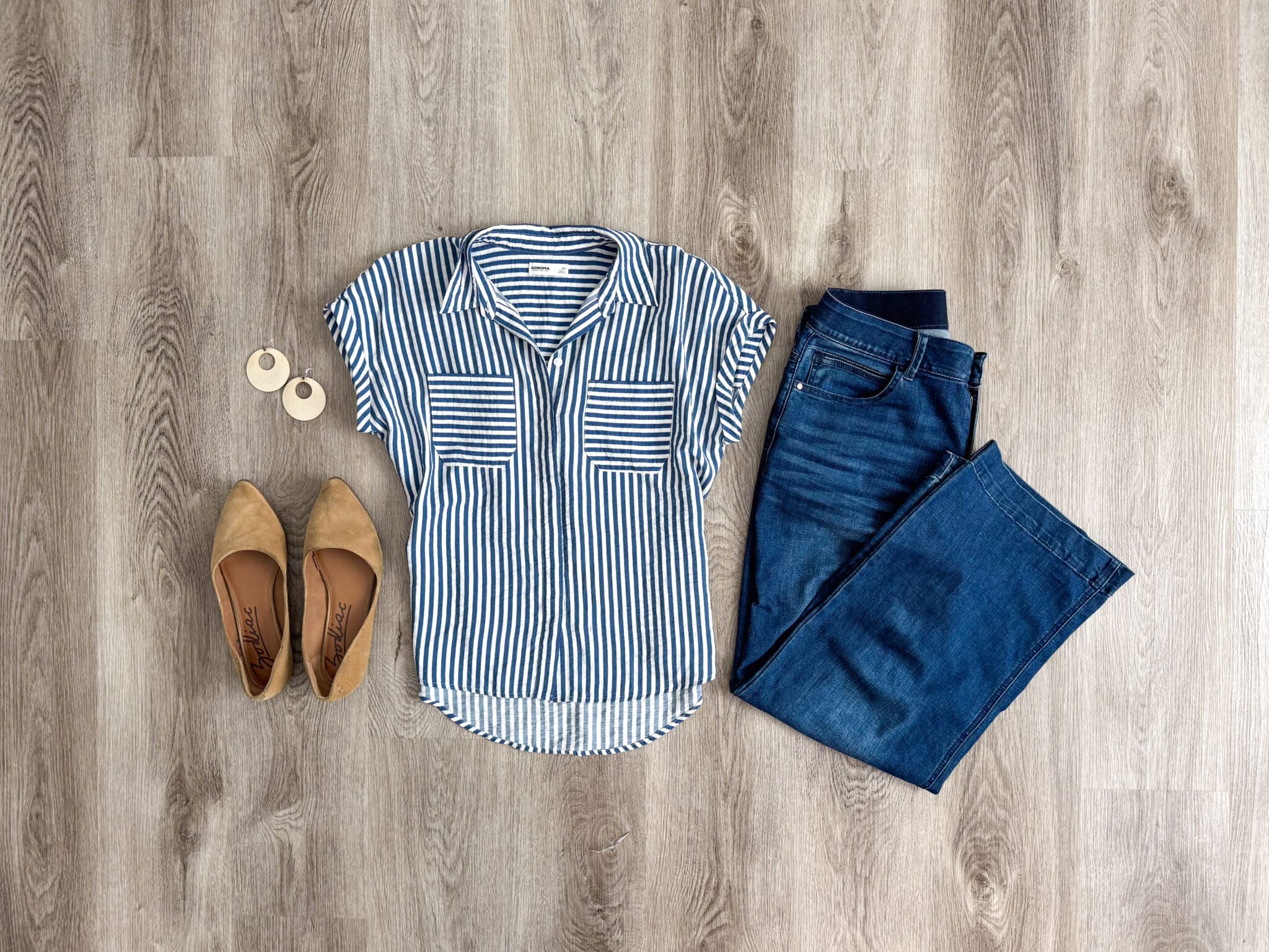 How to Pack for a Trip Without Overpacking (A Simple System That Actually Works) + how to pack for a trip + putting me together + tan flats + lightweight ivory earrings + easy to wear white and blue blouse + comfortable wide leg jeans
