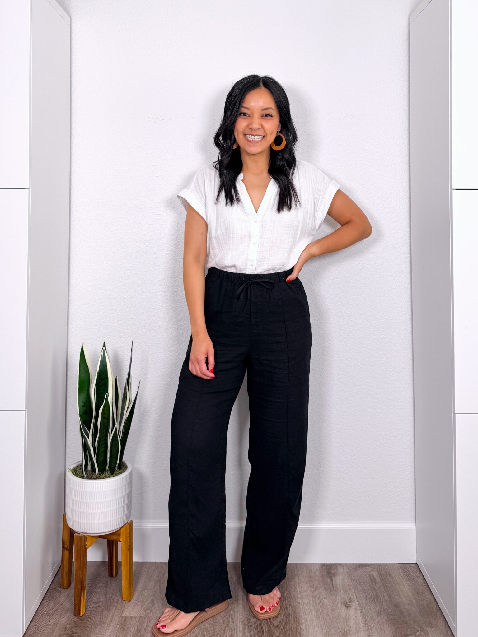 What to Wear With Black Linen Pants: 14 Outfit Ideas for Summer You Can Easily Copy + black linen pants outfit + putting me together + white gauze top + black wide leg linen pants + comfortable water friendly tan sandals + lightweight tan earrings