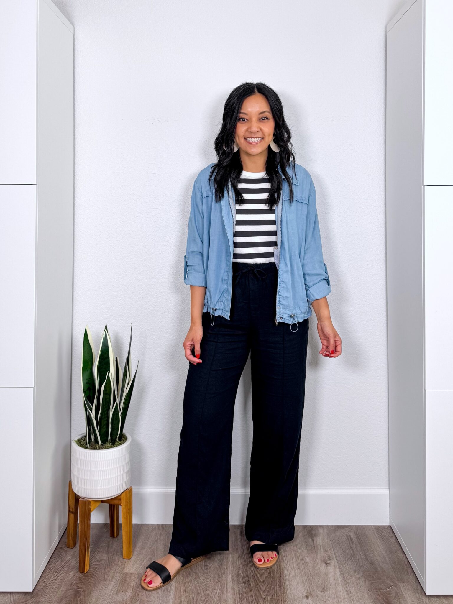 What to Wear With Black Linen Pants: 14 Outfit Ideas for Summer You Can Easily Copy + black linen pants outfit + putting me together + versatile black and white striped tank top sweater + black wide leg linen pants + lightweight denim jacket + black sandals + gold jewelry