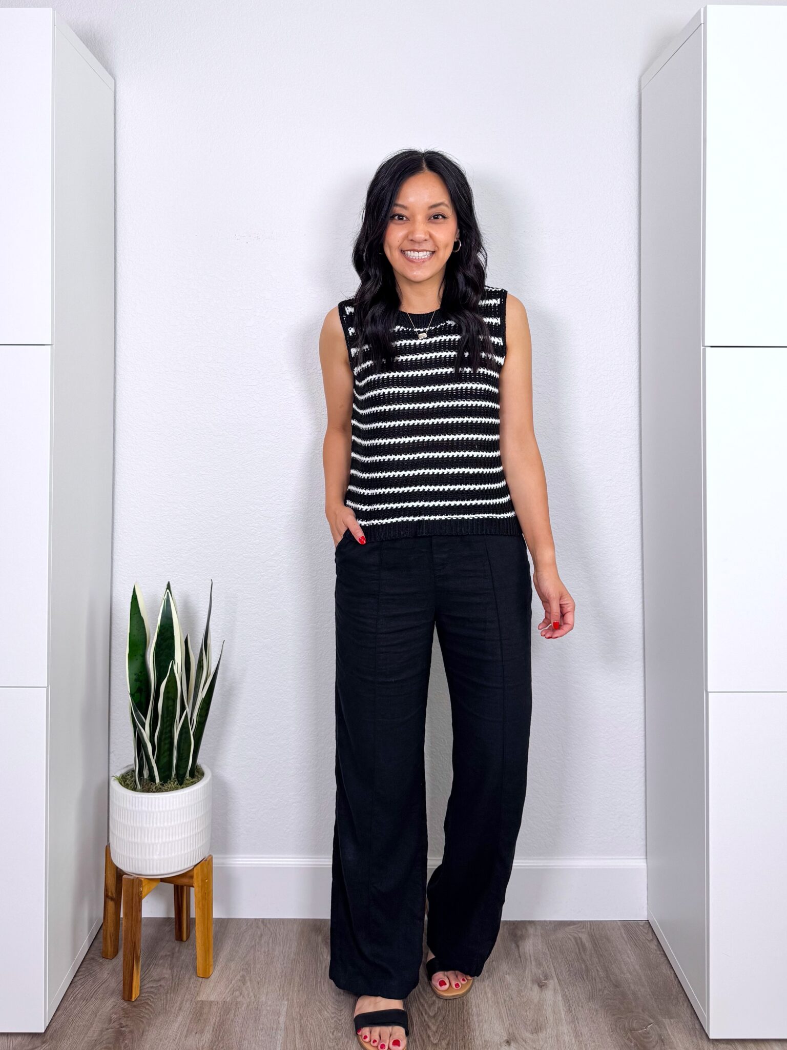 What to Wear With Black Linen Pants: 14 Outfit Ideas for Summer You Can Easily Copy + black linen pants outfit + putting me together + versatile black and white striped short sleeve sweater + black wide leg linen pants + comfortable black sandals + gold necklace + gold earrings