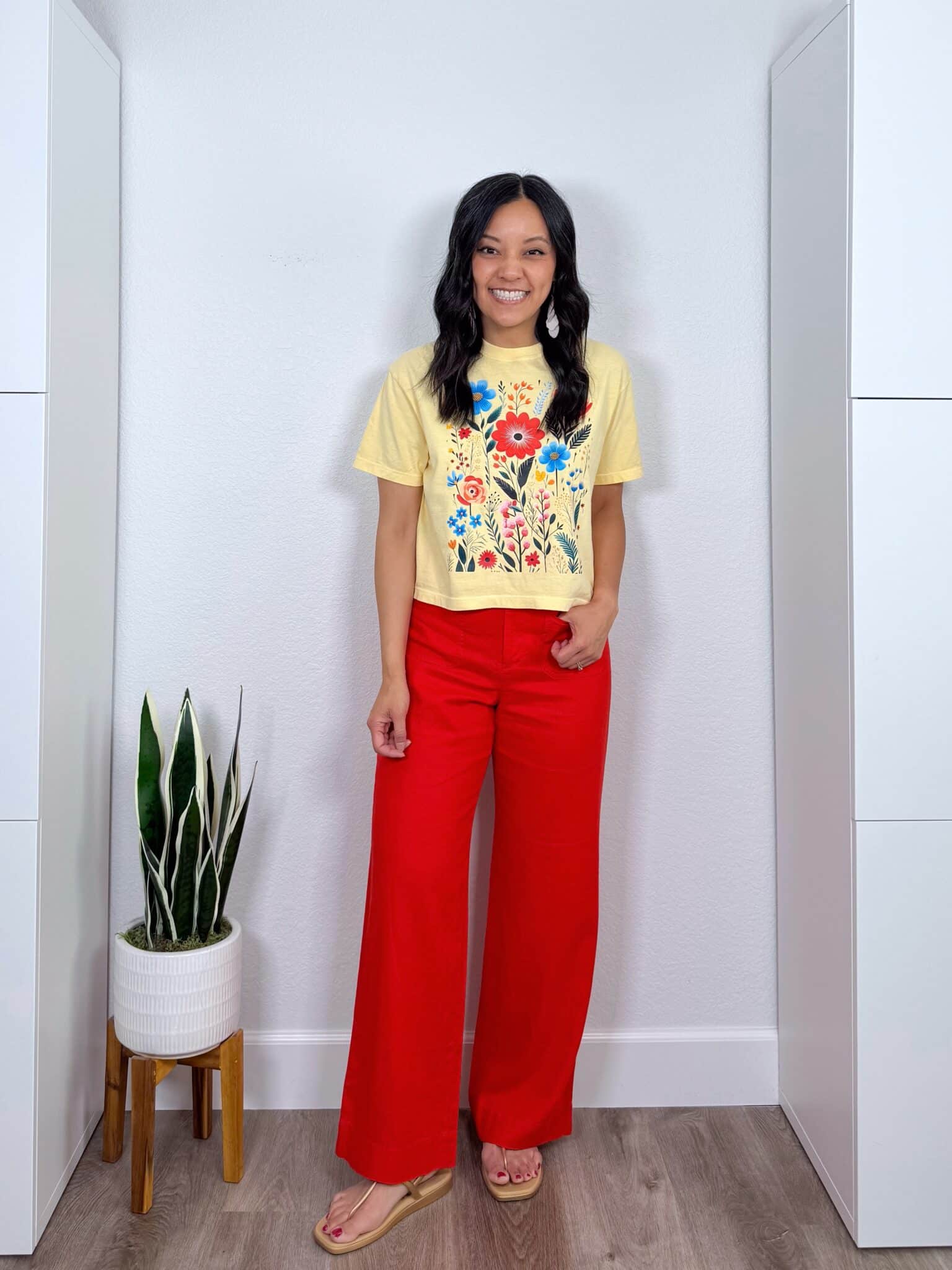 The Best Summer Trends for 2026 That Are Actually Wearable + putting me together + summer trends 2026 + butter yellow flowered graphic t shirt + tomato red pants + lightweight white earrings + gold metallic sandals