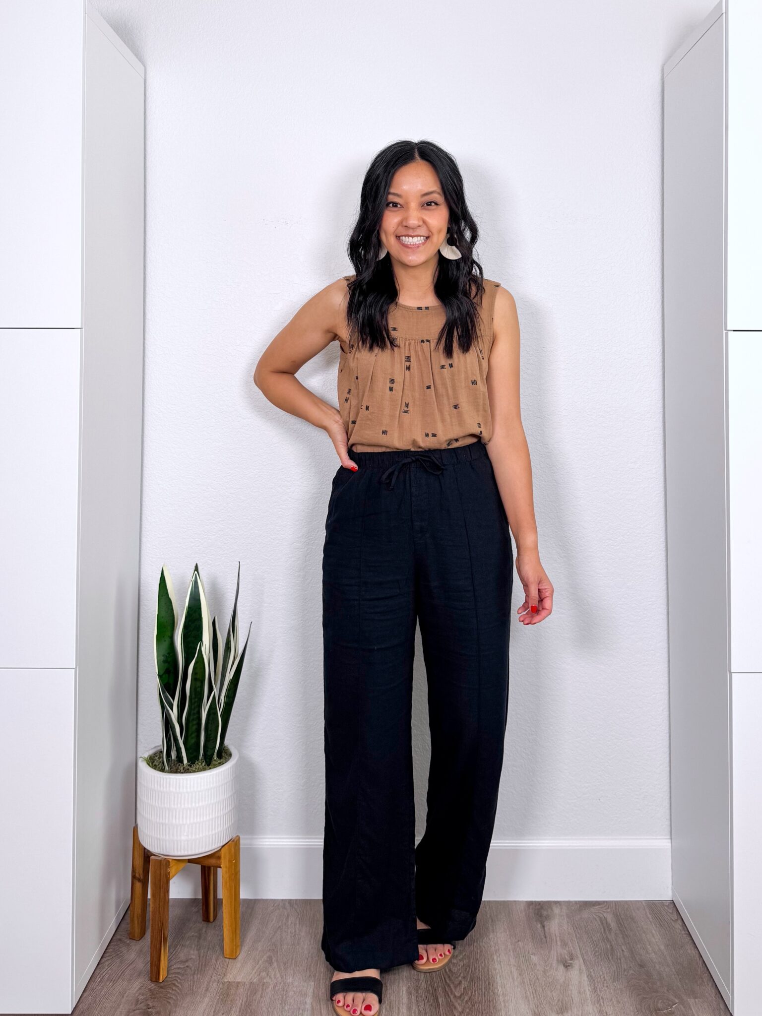 What to Wear With Black Linen Pants: 14 Outfit Ideas for Summer You Can Easily Copy + black linen pants outfit + putting me together + versatile black and tan tank top + black wide leg linen pants + comfortable black sandals