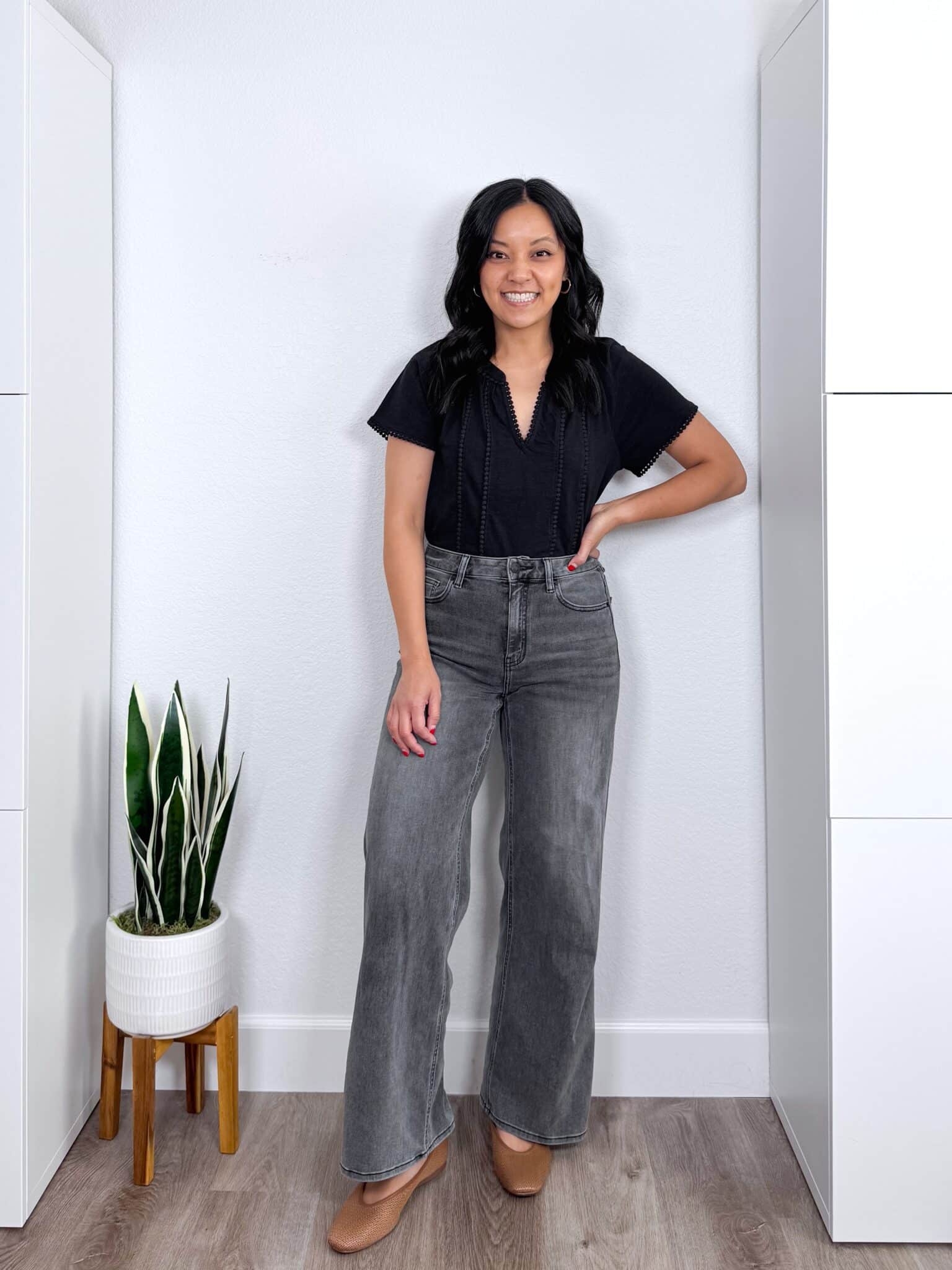 fall fashion trends 2026 + 8 Wearable Fall Fashion Trends to Try This Year + putting me together+ black elevated casual top + washed black wide leg jeans + tan flats + gold earrings